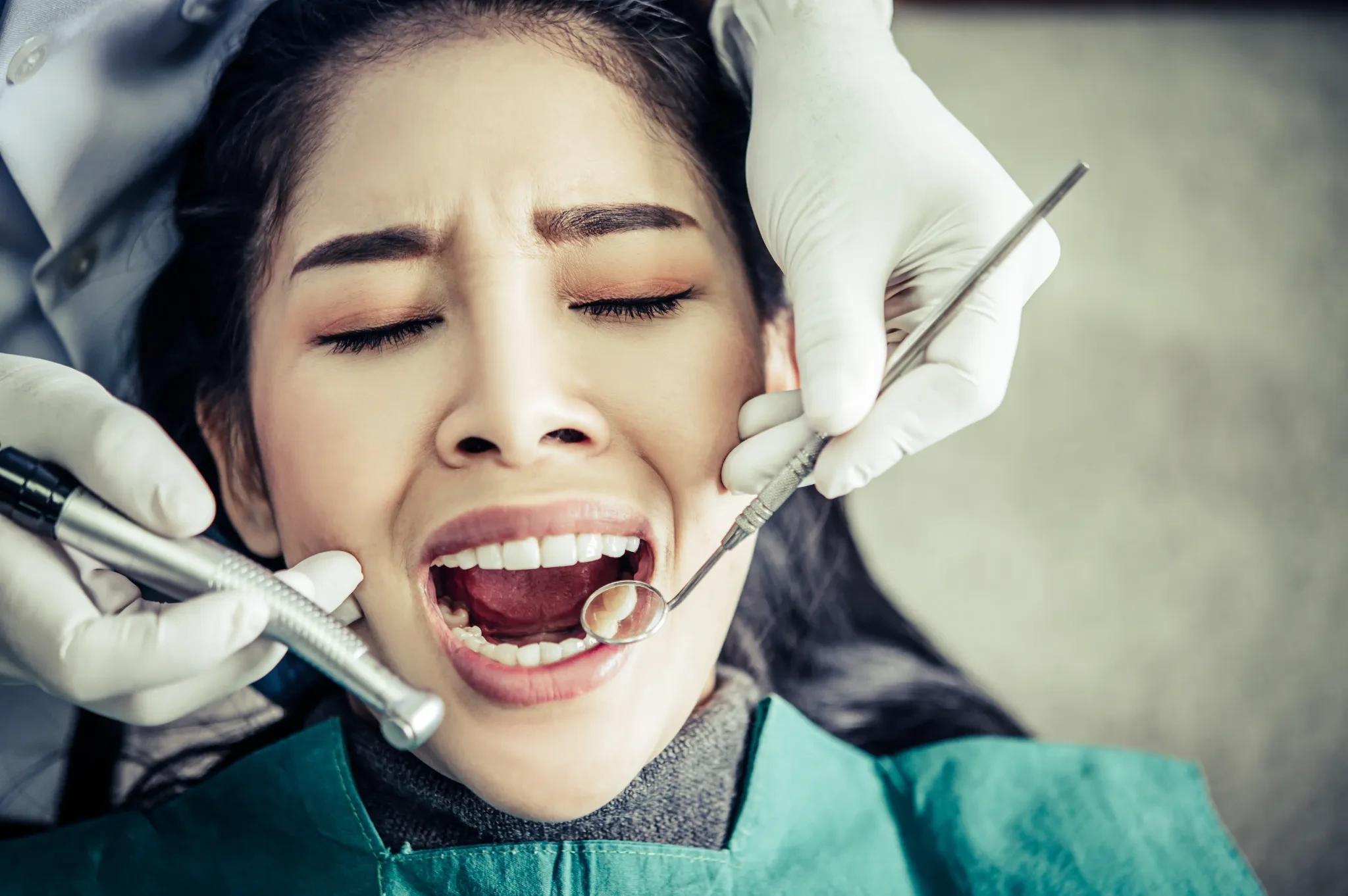 dentist examines patient s teeth 1
