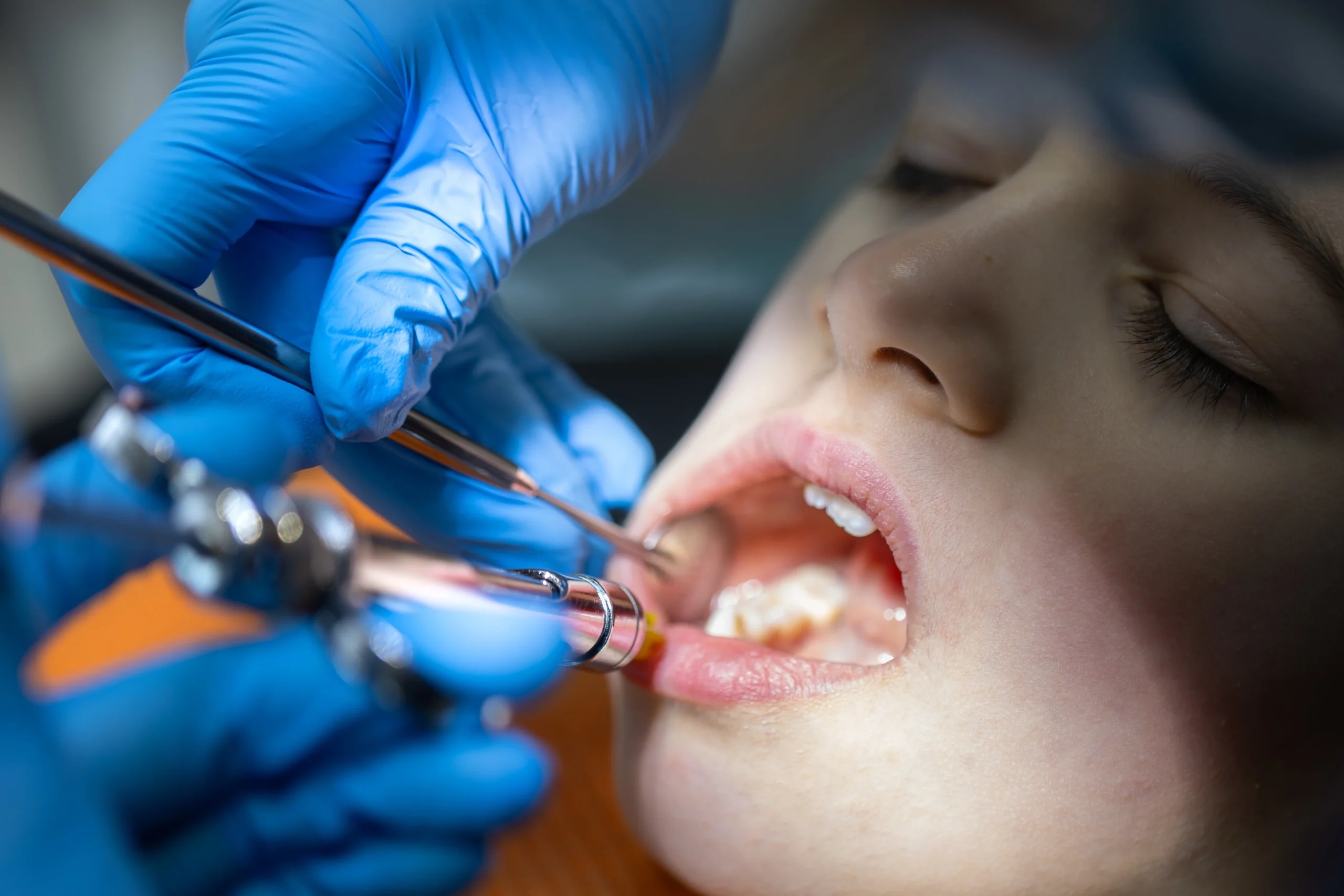 girl dentists office dentist examining child patients teeth dentistry concept scaled